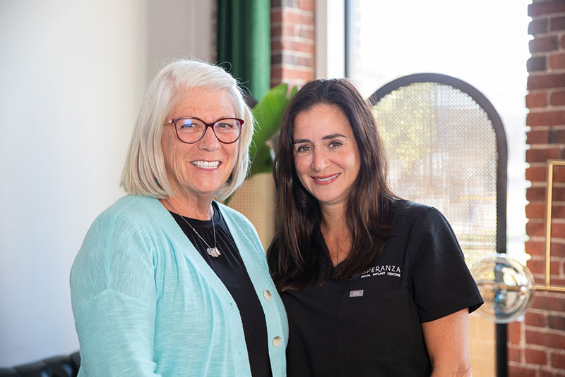 Dr. Caldroney with a full mouth dental implant patient